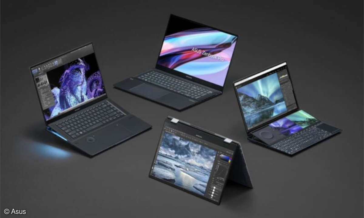 Asus notebooks on black surface