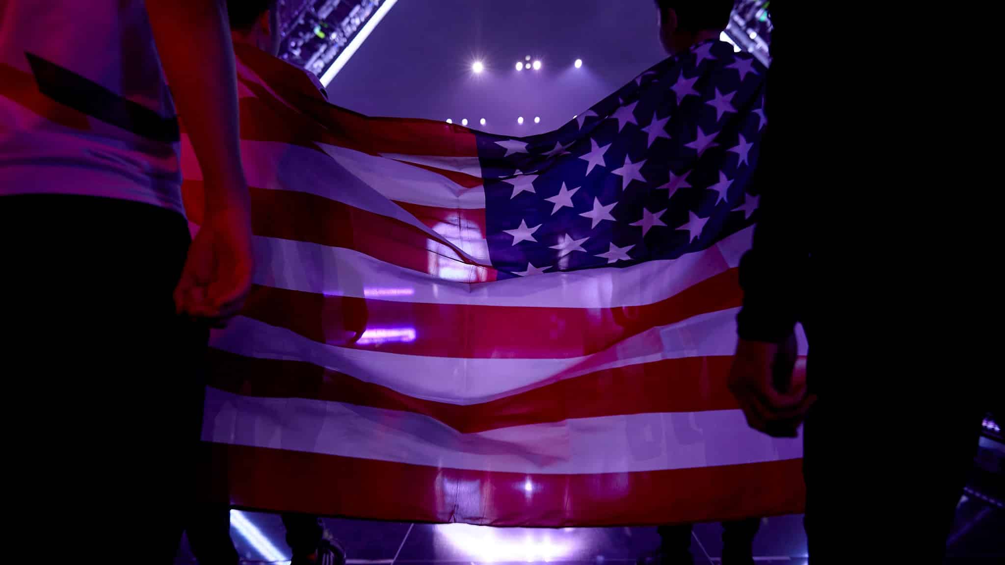 The United States flag held between two players before going on stage.