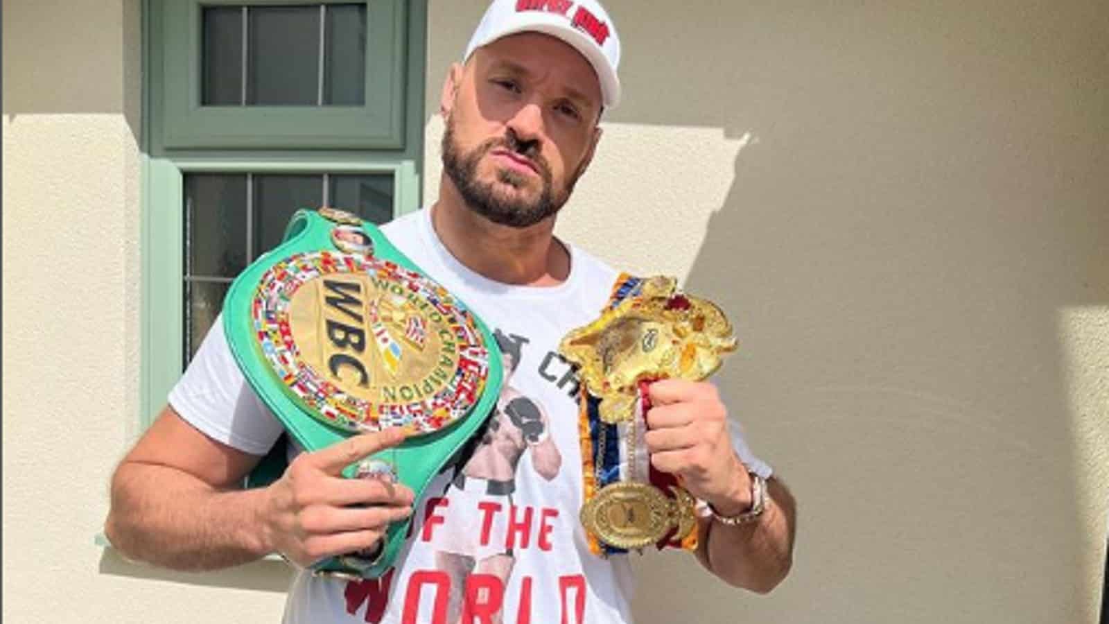 Tyson Fury posing with his victories