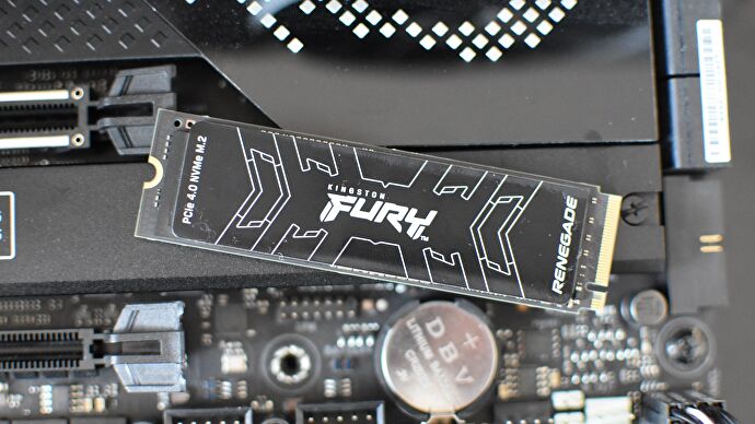 The Kingston Fury Renegade SSD resting on top of a motherboard.