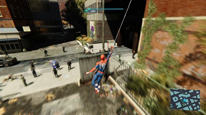 Spider-Man swings low through the streets of New York in Marvel's Spider-Man Remastered