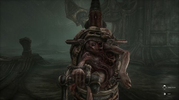 A humanoid trapped in an egg-shaped rock over its back, being pushed on a pram-like chair on rails in Scorn