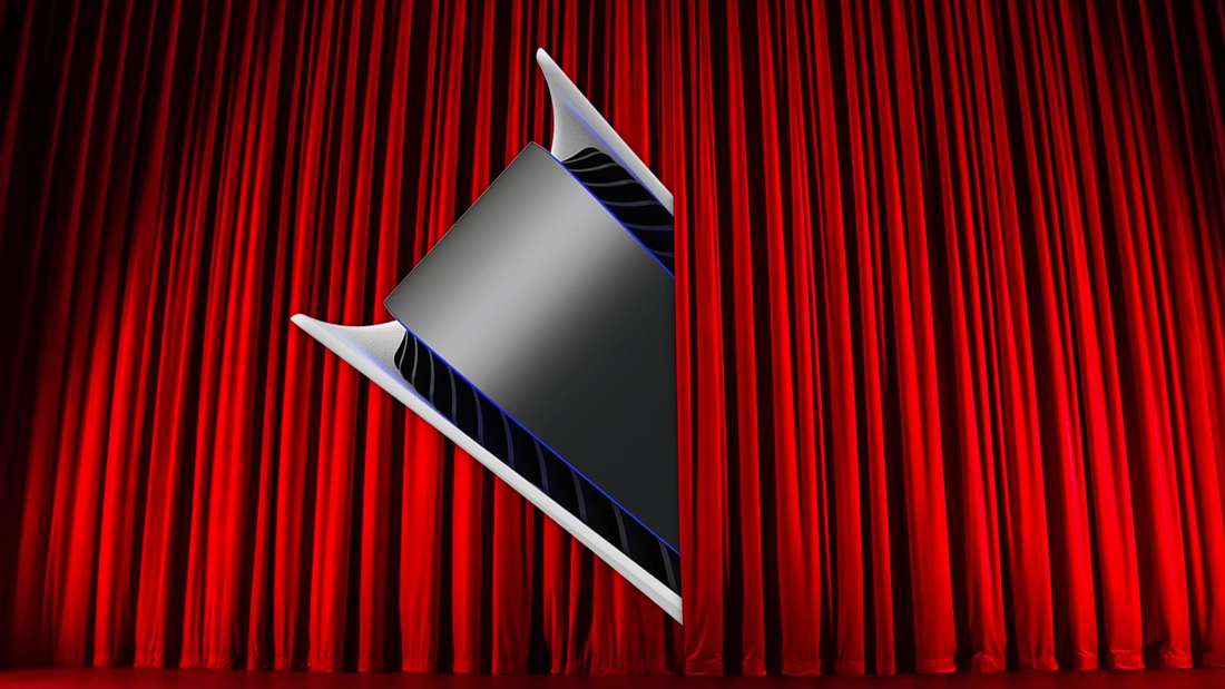 The PS5 peeks out from behind a curtain