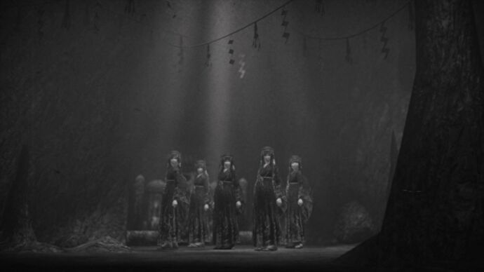 A group of hooded people gather in a cave in Fatal Frame: Mask of the Lunar Eclipse